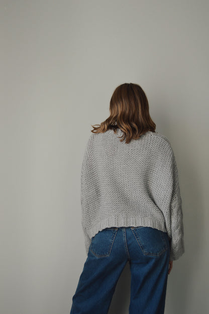 CLOUDY DAY CABLE KNIT SWEATER